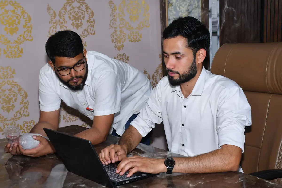Consultants reviewing documents with a client